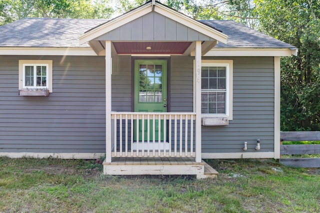 194 Main Rd, Passadumkeag, ME 04475 - entrance to property featuring a shingled roof and covered porch