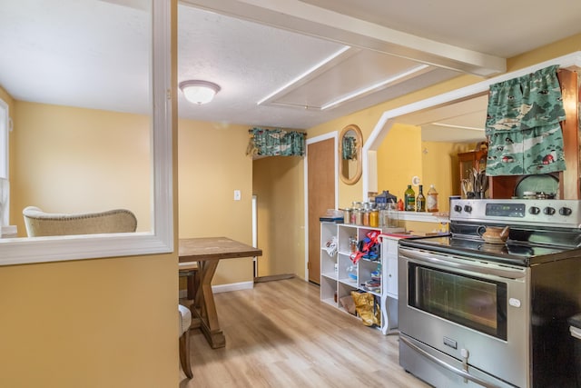 194 Main Rd, Passadumkeag, ME 04475 - kitchen featuring stainless steel electric stove and wood finished floors