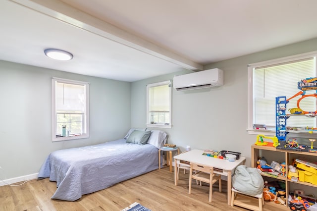 194 Main Rd, Passadumkeag, ME 04475 - bedroom with an AC wall unit, light wood-style flooring, multiple windows, and beam ceiling