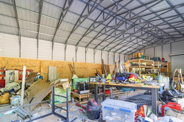 194 Main Rd, Passadumkeag, ME 04475 - garage featuring metal wall and a workshop area