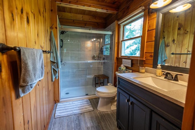 1103 Rte 135, Monmouth, ME 04259 - full bathroom featuring vanity, wood walls, a shower stall, a wood ceiling with exposed beams, and wood finished floors