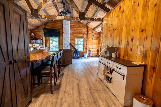 1103 Rte 135, Monmouth, ME 04259 - dining room with wood ceiling, light wood-style floors, and wooden walls