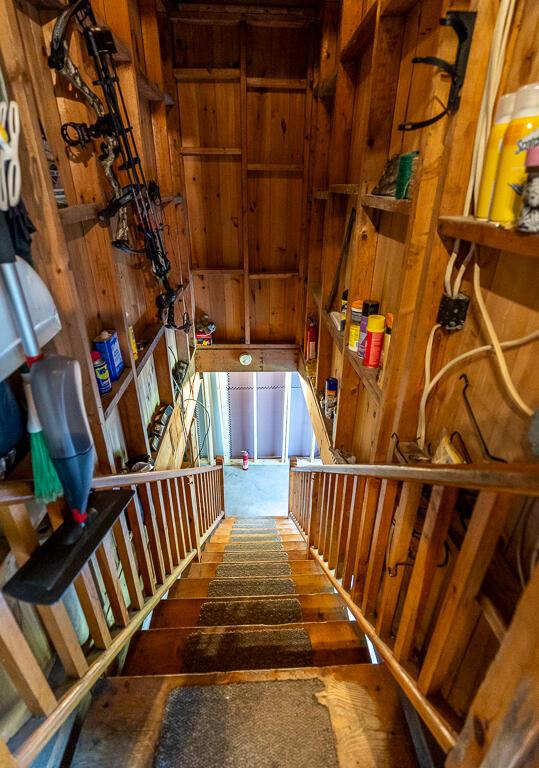 1103 Rte 135, Monmouth, ME 04259 - stairway featuring wood walls and wood finished floors
