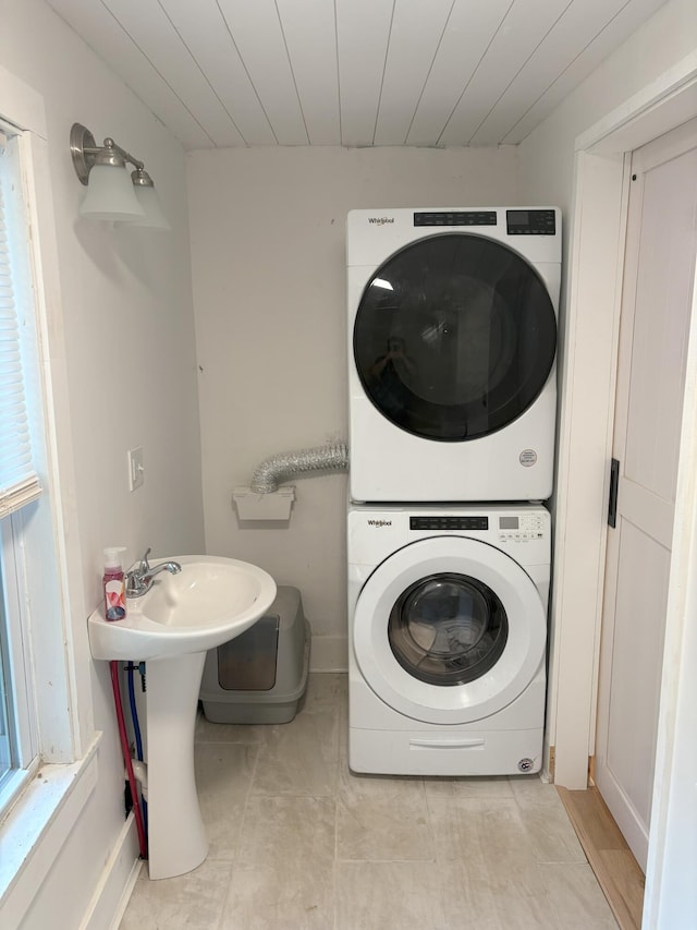 10 Valley St, Augusta, ME 04330 - washroom featuring stacked washer / drying machine, wood ceiling, and baseboards