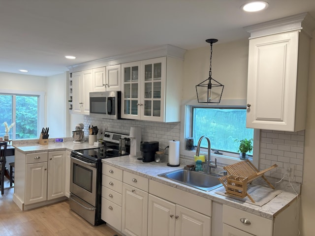10 Valley St, Augusta, ME 04330 - kitchen featuring appliances with stainless steel finishes, a sink, white cabinets, glass insert cabinets, and recessed lighting