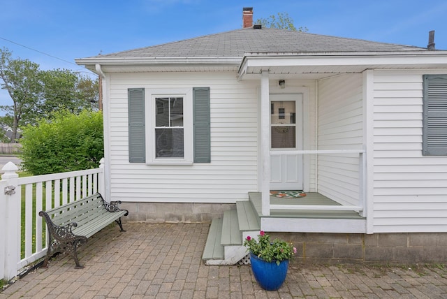 134 W Grand Ave, Old Orchard Beach, ME 04064 - rear view of property with a shingled roof