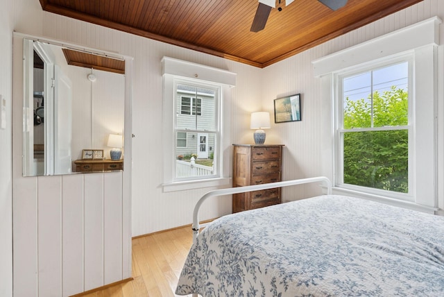 134 W Grand Ave, Old Orchard Beach, ME 04064 - bedroom with multiple windows, wood finished floors, wooden ceiling, crown molding, and a ceiling fan