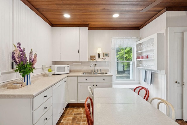 134 W Grand Ave, Old Orchard Beach, ME 04064 - kitchen with wooden ceiling, white appliances, white cabinets, crown molding, and light countertops