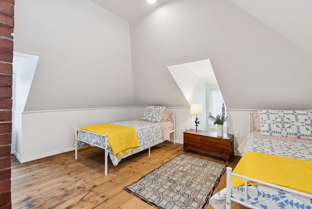 134 W Grand Ave, Old Orchard Beach, ME 04064 - bedroom featuring hardwood / wood-style flooring, vaulted ceiling, and wainscoting