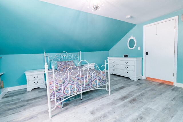 188 Old Chadbourne Rd, Lewiston, ME 04240 - bedroom with wood finished floors, baseboards, and vaulted ceiling