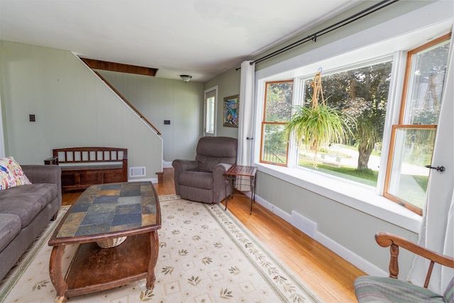 188 Old Chadbourne Rd, Lewiston, ME 04240 - living room with light wood-style flooring, stairs, and baseboards