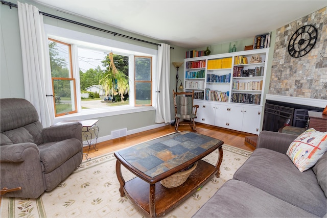 188 Old Chadbourne Rd, Lewiston, ME 04240 - living room featuring light wood finished floors and a fireplace