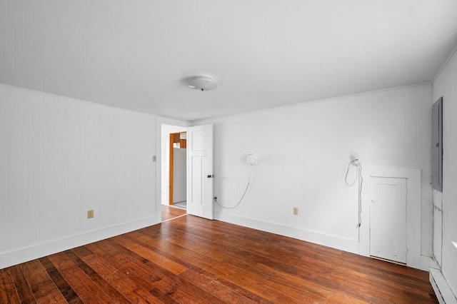 511 Ocean Ave, Wells, ME 04090 - spare room featuring wood-type flooring, electric panel, and a baseboard heating unit