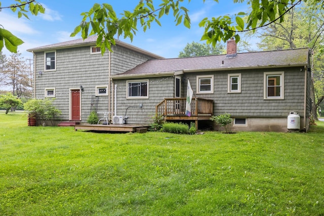 535 Spring St, Westbrook, ME 04092 - back of house featuring a chimney, a lawn, a wooden deck, and roof with shingles