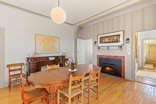 1392 N Haven Rd, Vinalhaven, ME 04863 - dining area featuring light wood-style floors and a fireplace