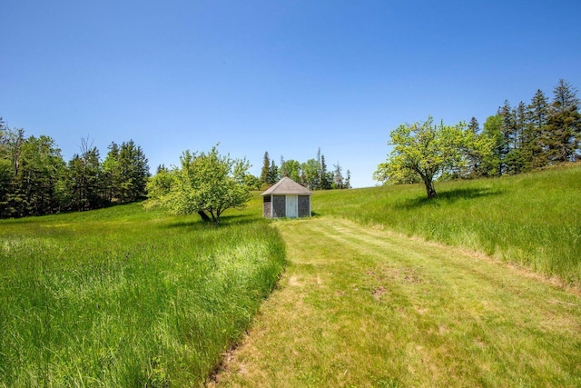 1392 N Haven Rd, Vinalhaven, ME 04863 - view of yard featuring a rural view and a storage shed