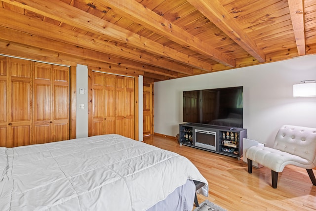 324 Pleasant Pond Rd, Turner, ME 04282 - bedroom with wood finished floors, two closets, and a wooden ceiling with exposed beams