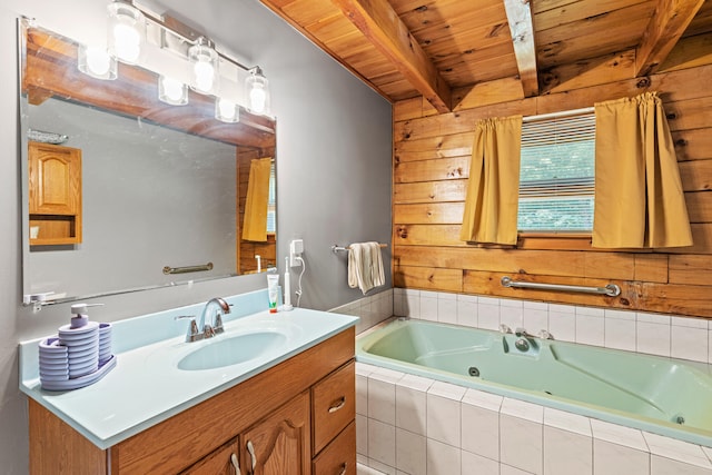 324 Pleasant Pond Rd, Turner, ME 04282 - bathroom with a tub with jets, a wood ceiling with exposed beams, vanity, and wooden walls