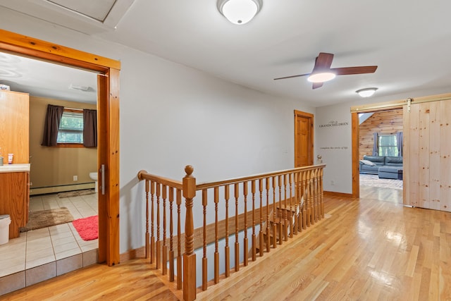 324 Pleasant Pond Rd, Turner, ME 04282 - hall featuring an upstairs landing, baseboard heating, and light wood finished floors