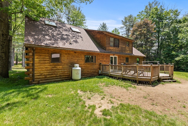 324 Pleasant Pond Rd, Turner, ME 04282 - back of property with a wooden deck, a yard, a shingled roof, and log siding