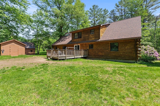 324 Pleasant Pond Rd, Turner, ME 04282 - rear view of property featuring a wooden deck, log exterior, a lawn, and a shingled roof