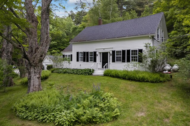 419 River Rd, Newcastle, ME 04553 - cape cod-style house with a chimney, roof with shingles, and a front yard