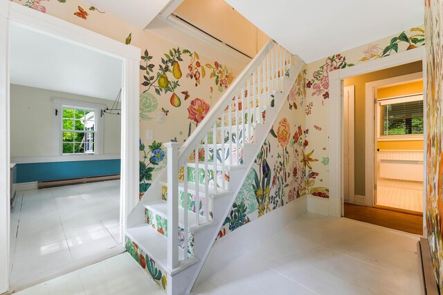 419 River Rd, Newcastle, ME 04553 - stairs featuring baseboard heating and wallpapered walls