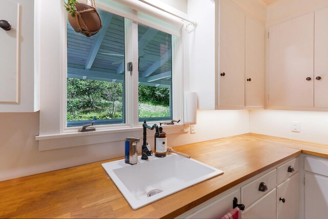 419 River Rd, Newcastle, ME 04553 - kitchen with a sink and white cabinets