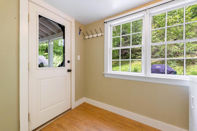 419 River Rd, Newcastle, ME 04553 - entryway with light wood-style flooring and washer / dryer
