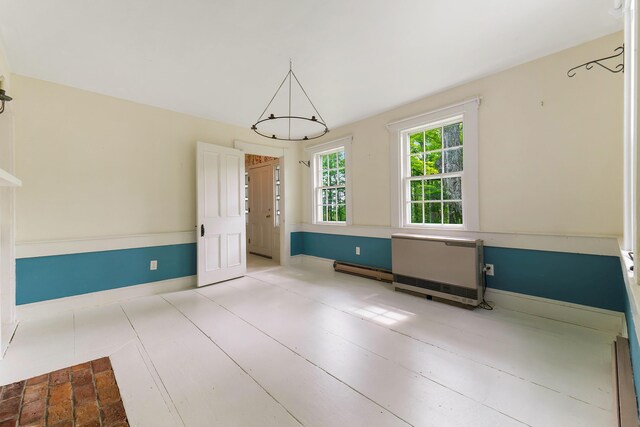 419 River Rd, Newcastle, ME 04553 - unfurnished dining area featuring baseboards and a baseboard heating unit