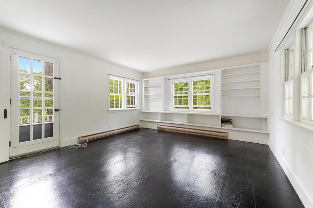 419 River Rd, Newcastle, ME 04553 - spare room featuring a baseboard radiator, built in features, a baseboard heating unit, and wood finished floors