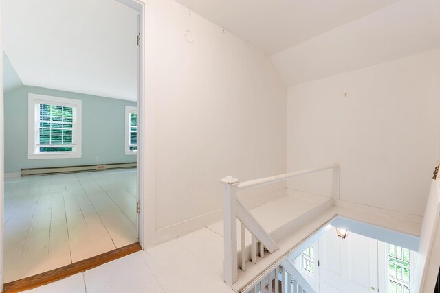419 River Rd, Newcastle, ME 04553 - corridor with vaulted ceiling, healthy amount of natural light, baseboard heating, an upstairs landing, and tile patterned flooring
