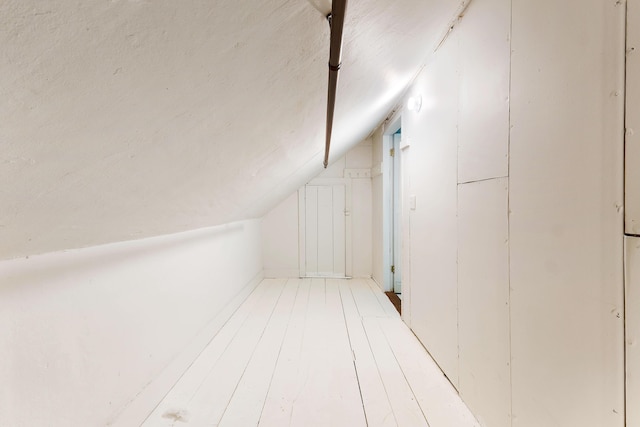 419 River Rd, Newcastle, ME 04553 - additional living space featuring vaulted ceiling and light wood-type flooring