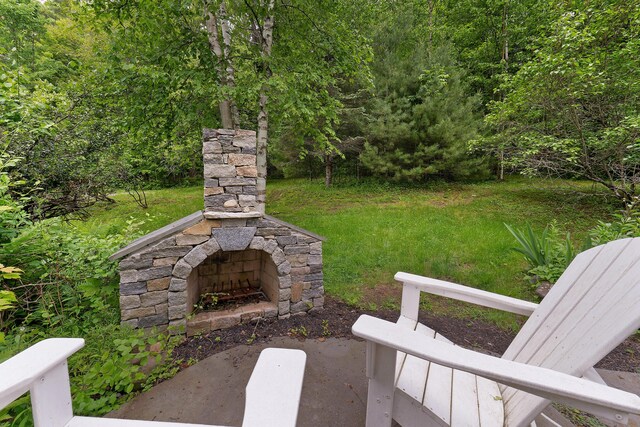 419 River Rd, Newcastle, ME 04553 - view of yard featuring an outdoor stone fireplace