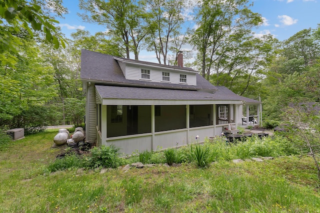 419 River Rd, Newcastle, ME 04553 - view of front facade featuring a chimney, a sunroom, and roof with shingles