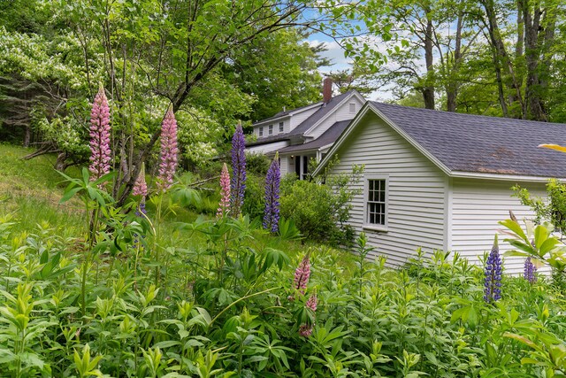 419 River Rd, Newcastle, ME 04553 - view of side of home with a shingled roof