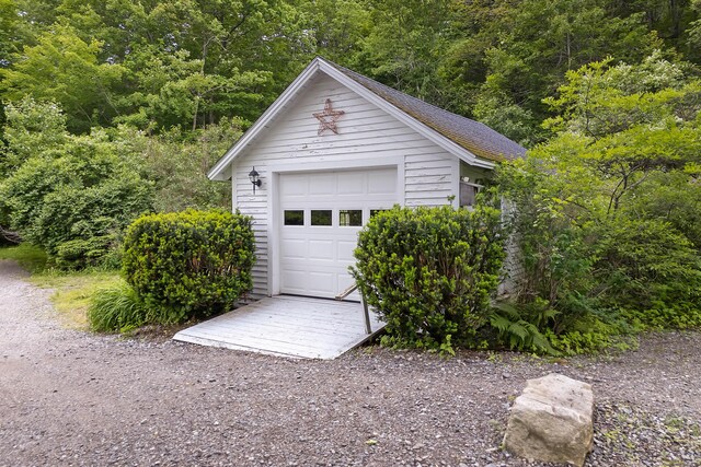 419 River Rd, Newcastle, ME 04553 - garage featuring a forest view