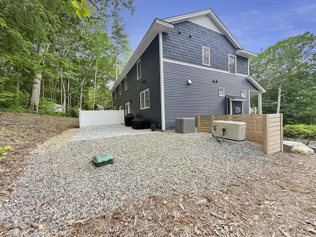132 Mineral Spring Rd Unit 1, Windham, ME 04062 - view of side of property featuring a cooling unit and a patio area