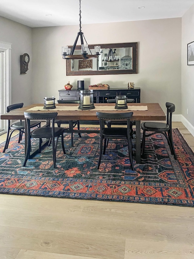 132 Mineral Spring Rd Unit 1, Windham, ME 04062 - dining space with wood finished floors and a chandelier