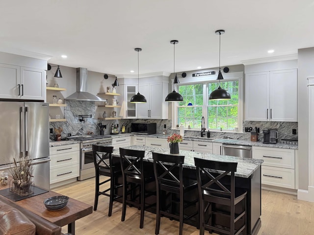 132 Mineral Spring Rd Unit 1, Windham, ME 04062 - kitchen with stainless steel appliances, wall chimney range hood, open shelves, backsplash, and recessed lighting