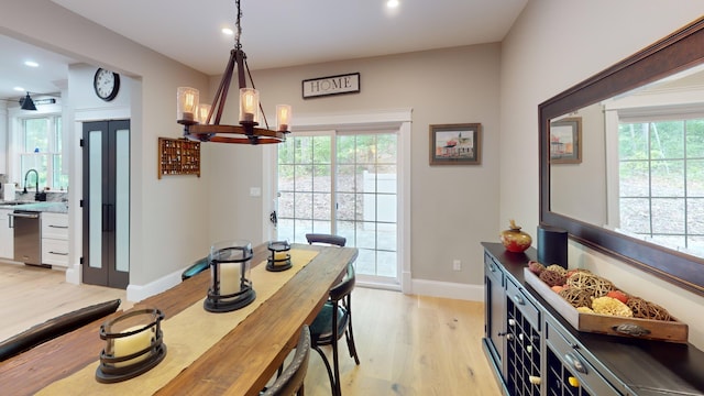 132 Mineral Spring Rd Unit 1, Windham, ME 04062 - dining area featuring a chandelier, light wood-type flooring, recessed lighting, and plenty of natural light