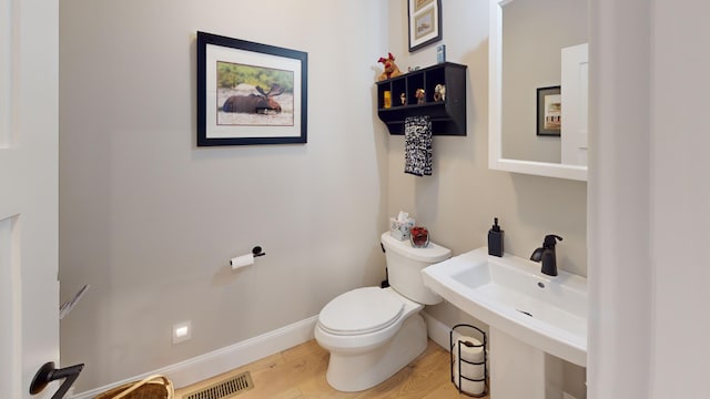 132 Mineral Spring Rd Unit 1, Windham, ME 04062 - bathroom featuring toilet and wood finished floors