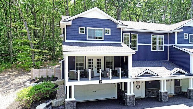132 Mineral Spring Rd Unit 1, Windham, ME 04062 - view of front of property featuring french doors, an attached garage, roof with shingles, driveway, and a porch