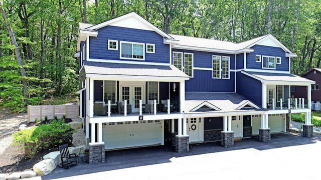 132 Mineral Spring Rd Unit 1, Windham, ME 04062 - view of front of house featuring a garage, a balcony, french doors, and driveway