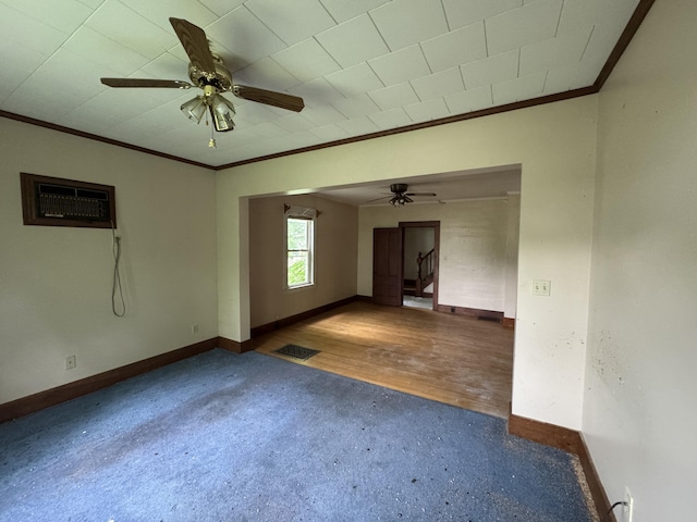 95 Eastern Ave, Augusta, ME 04330 - carpeted empty room with ornamental molding, baseboards, ceiling fan, and a wall mounted air conditioner