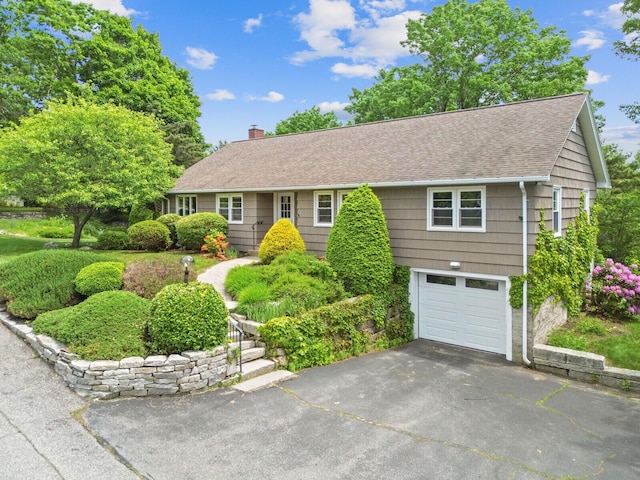 24 High St, Hallowell, ME 04347 - single story home featuring roof with shingles, a chimney, a garage, and driveway
