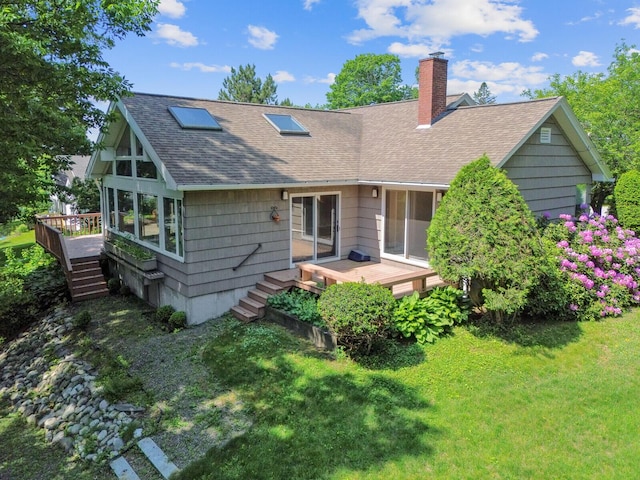 24 High St, Hallowell, ME 04347 - rear view of house with a deck, a shingled roof, a chimney, a lawn, and stairway