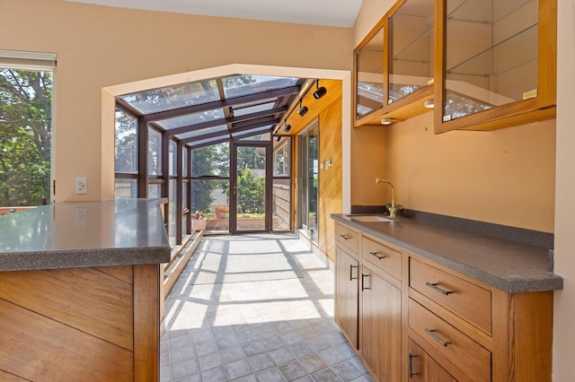 24 High St, Hallowell, ME 04347 - kitchen featuring dark countertops and glass insert cabinets