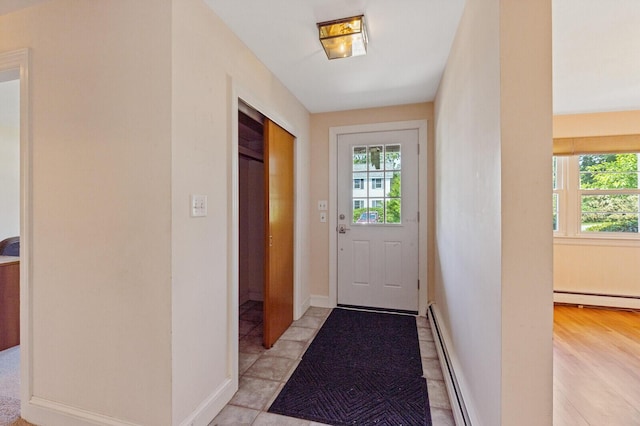 24 High St, Hallowell, ME 04347 - doorway to outside with baseboard heating and a baseboard radiator