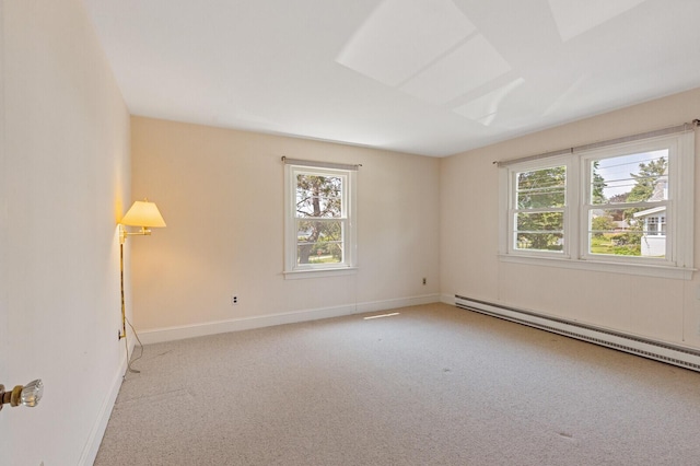 24 High St, Hallowell, ME 04347 - carpeted empty room featuring a baseboard heating unit and baseboards